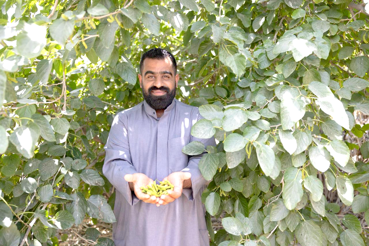 Happy: Mohsen displays the Kashmiri variety growing in his farm