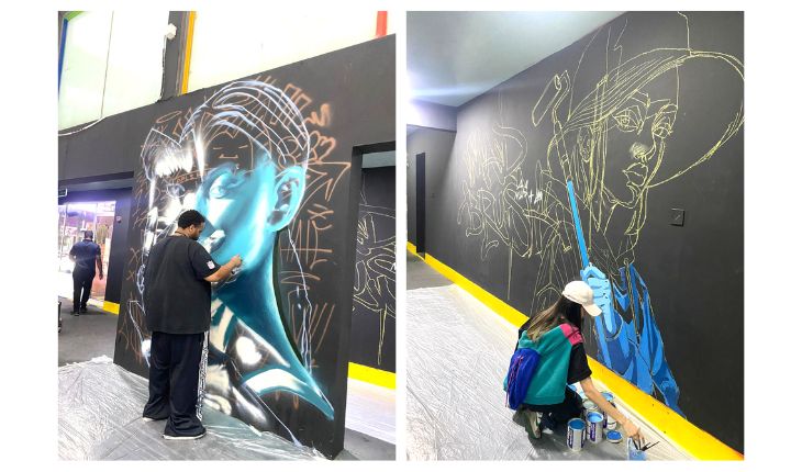 DESIGN: Graffiti artists working on their pieces