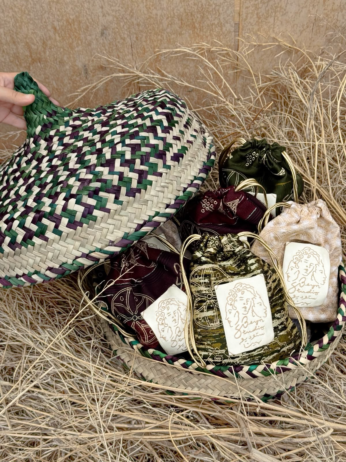 Weaves: The pouches featuring Nakhda presented in a traditional basket