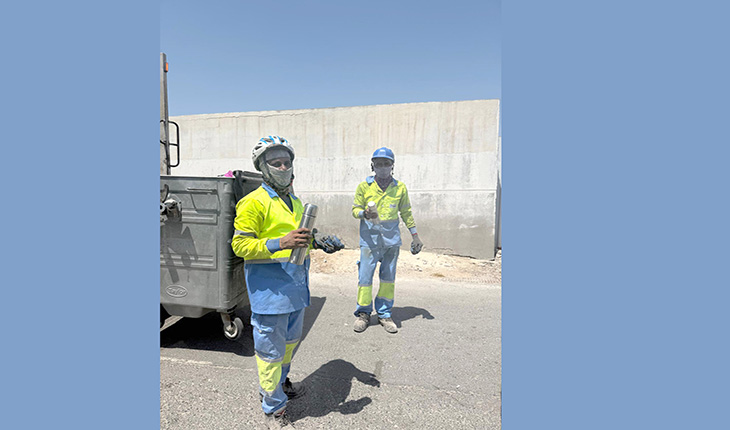 Happy: Workers with their bottles